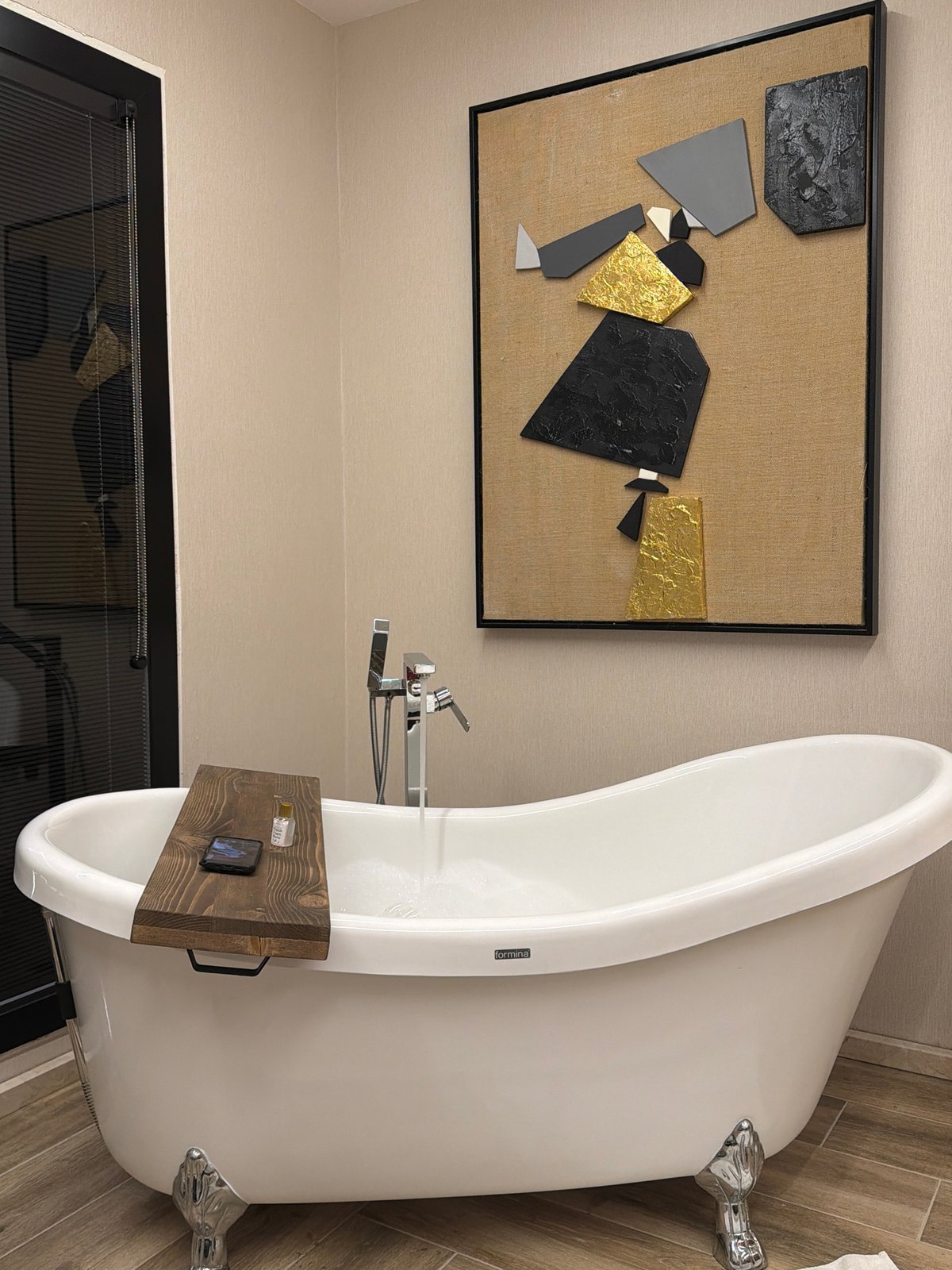 Modern interior spaces with bathtub and floral arrangements documented