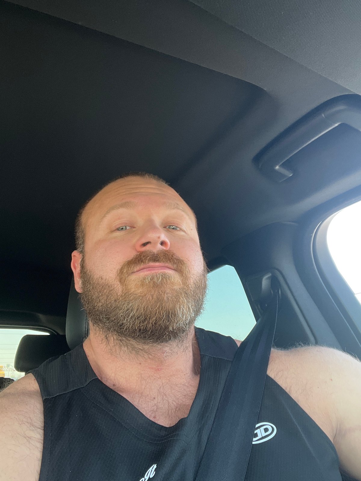 Man travels sunny road in Chaikovsky, Russia