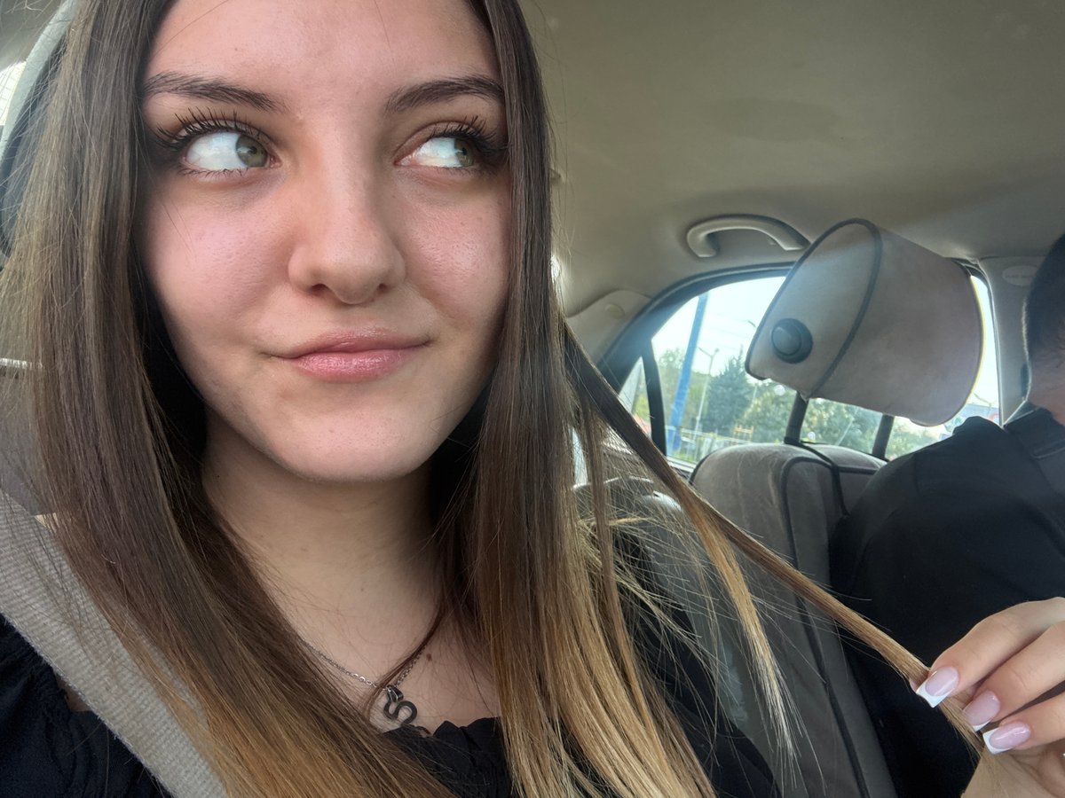 Two people photographed in vehicle interior, Sofia morning