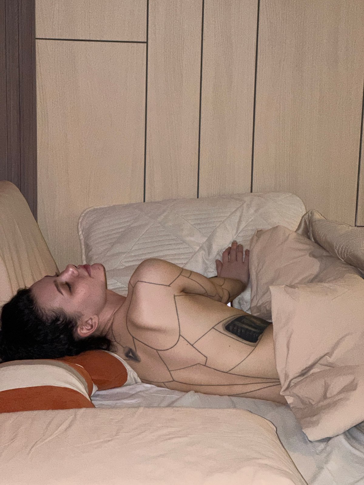 Woman in curled position observed on bed in Kazan