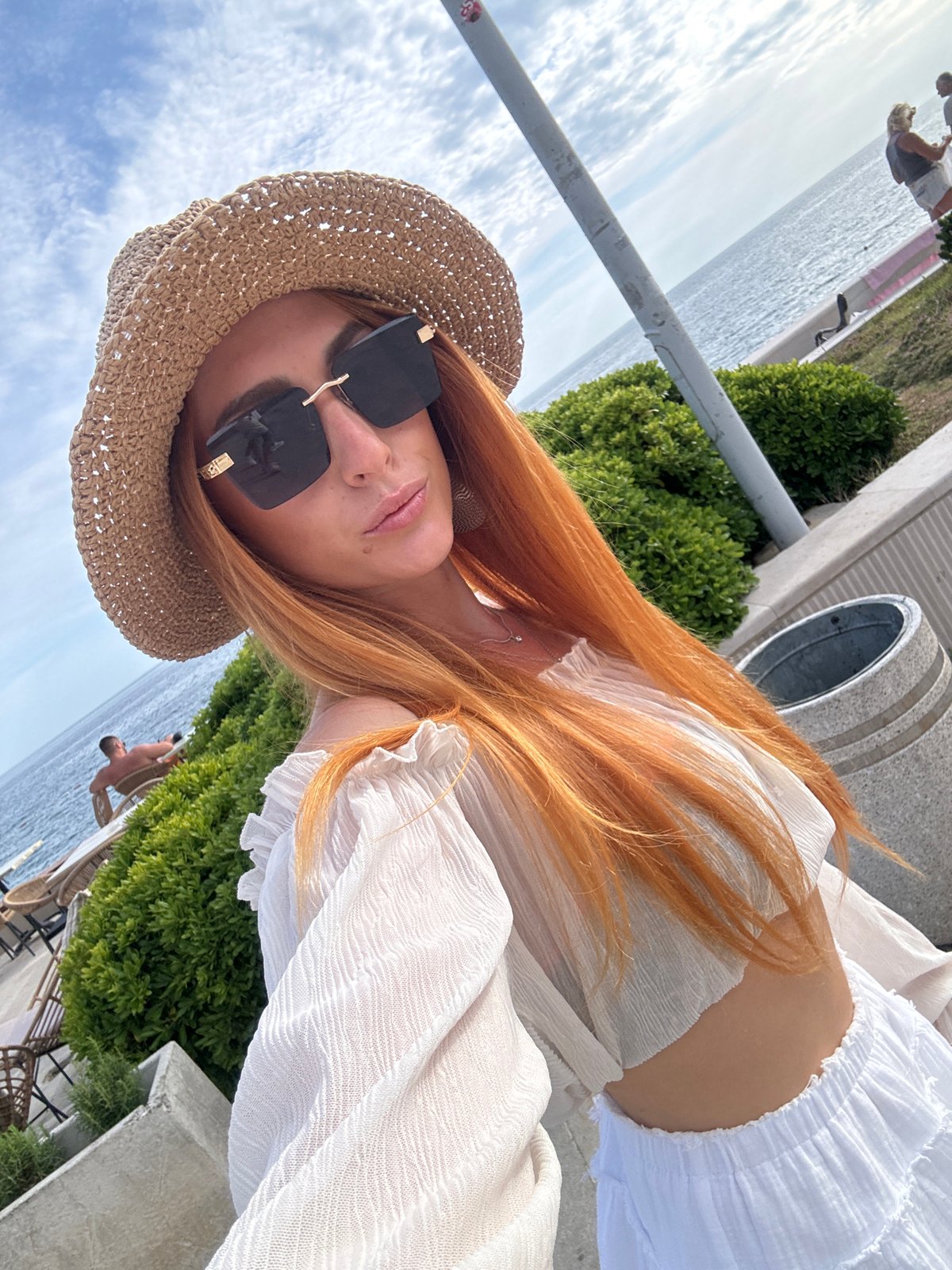 Tourist selfies captured on Petrovac promenade during cloudy afternoon