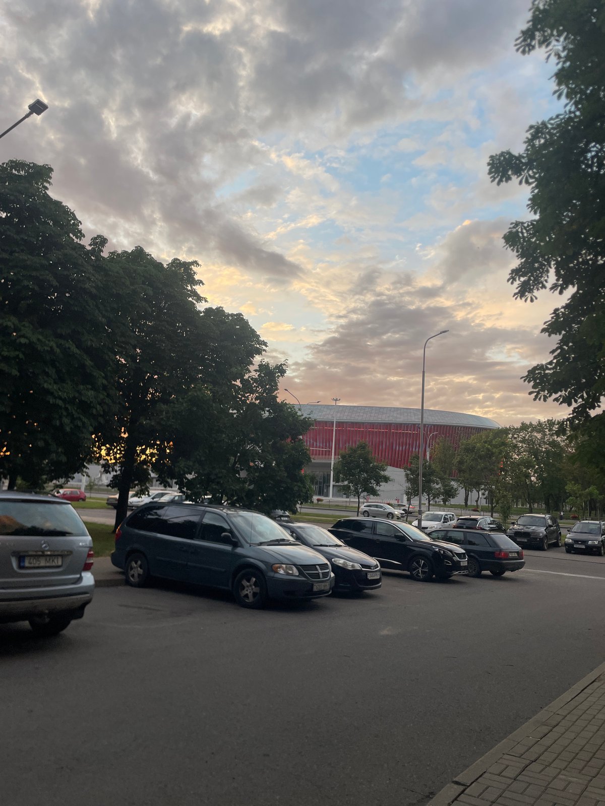 Chilling outside near a stadium as the sun goes down