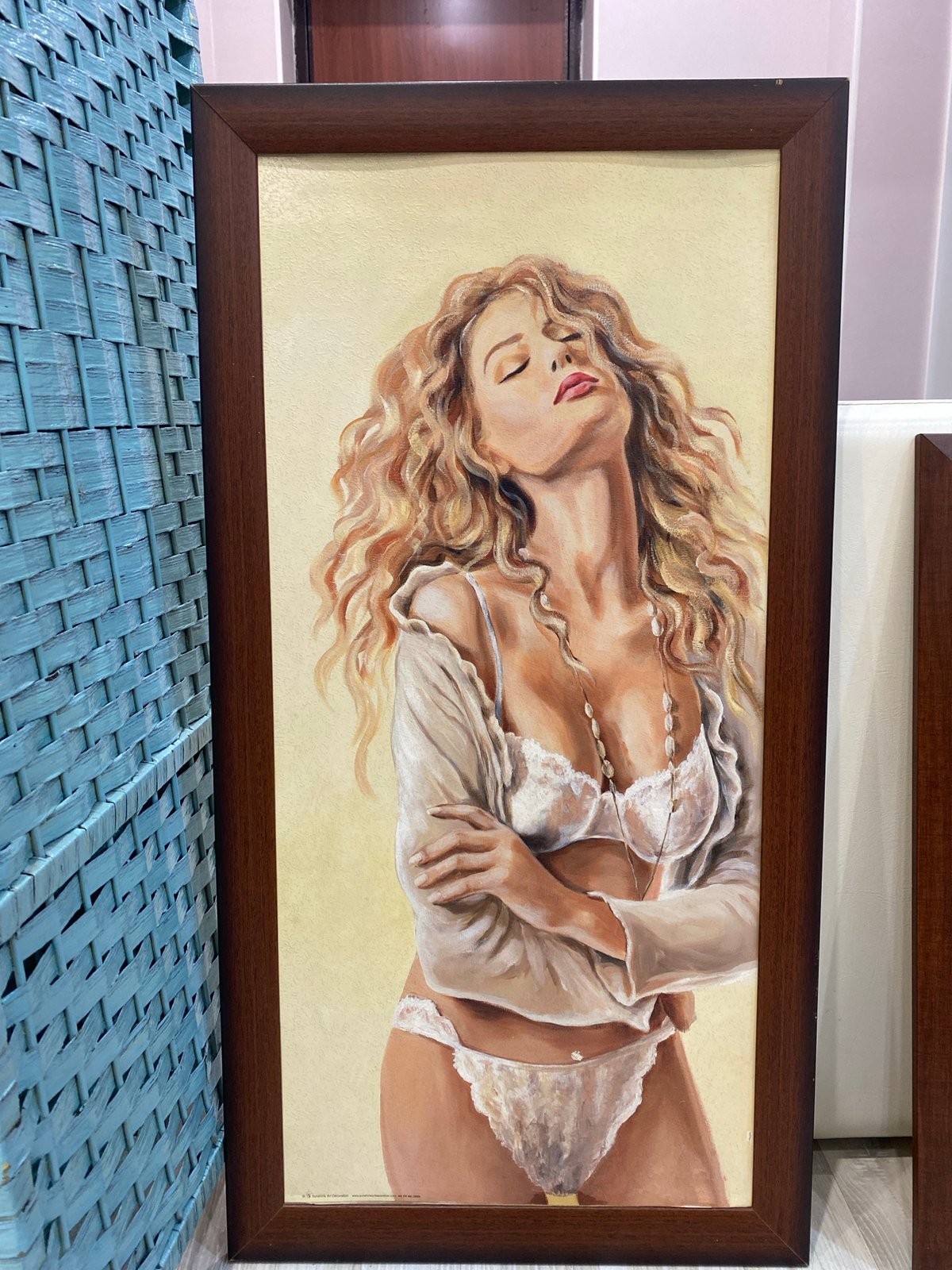 Art collection featuring reclining female figures displayed indoors