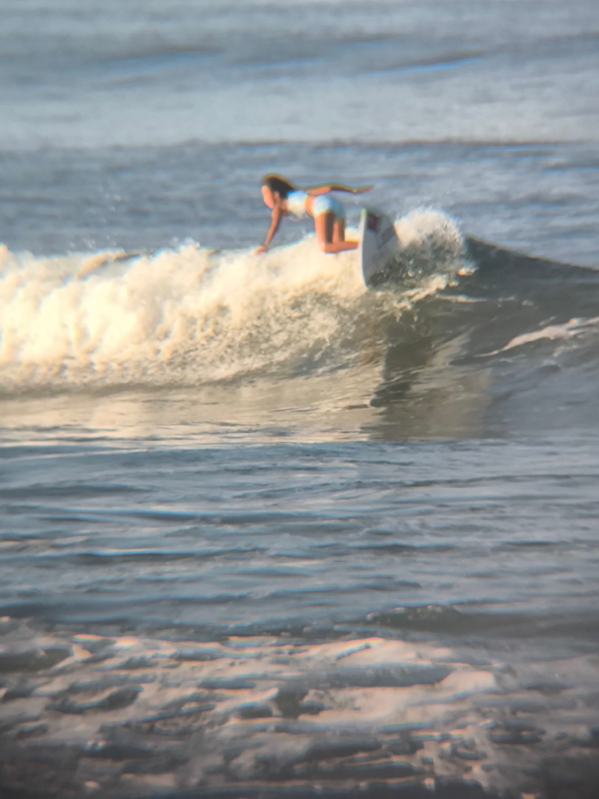 Evening surf session draws multiple participants to North Kuta beach