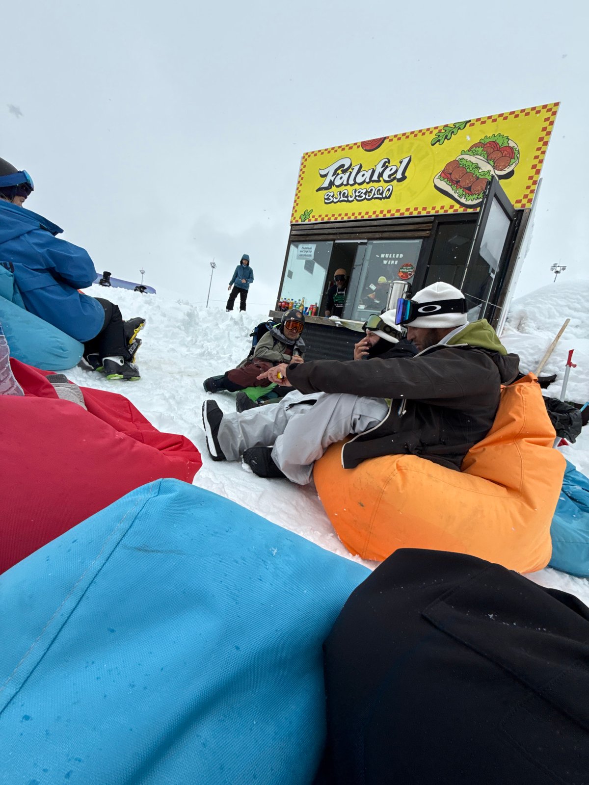 Tourist poses for photos during gondola ride at Georgian ski resort