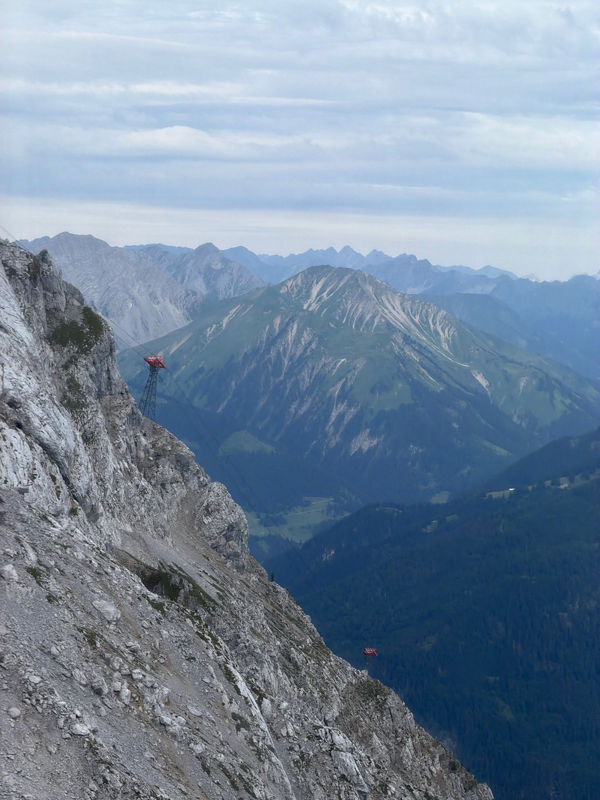 Cable cars and layered peaks in Grainau's alpine landscape