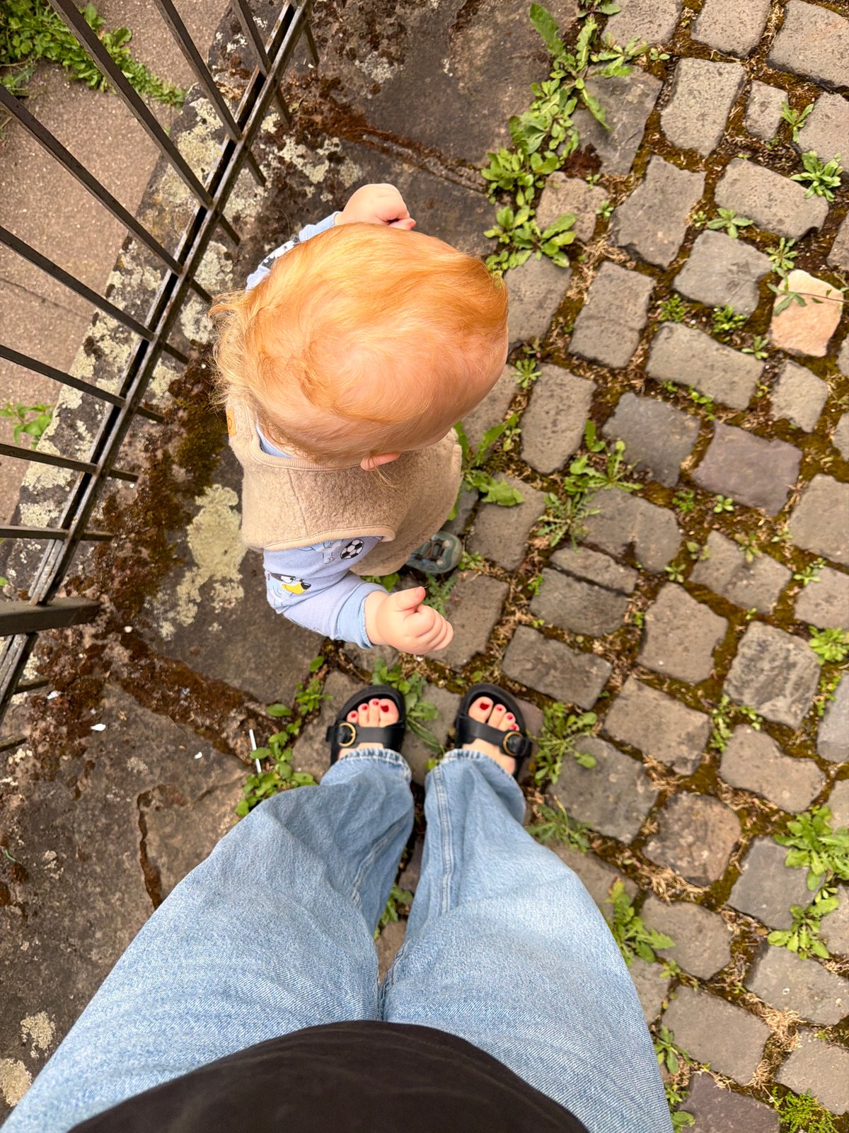 Adult, child visit historic Meisenheim as water wheel turns