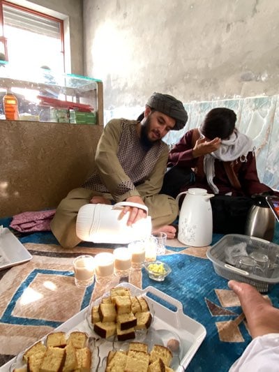 Traditional tea service captured at indoor social gathering