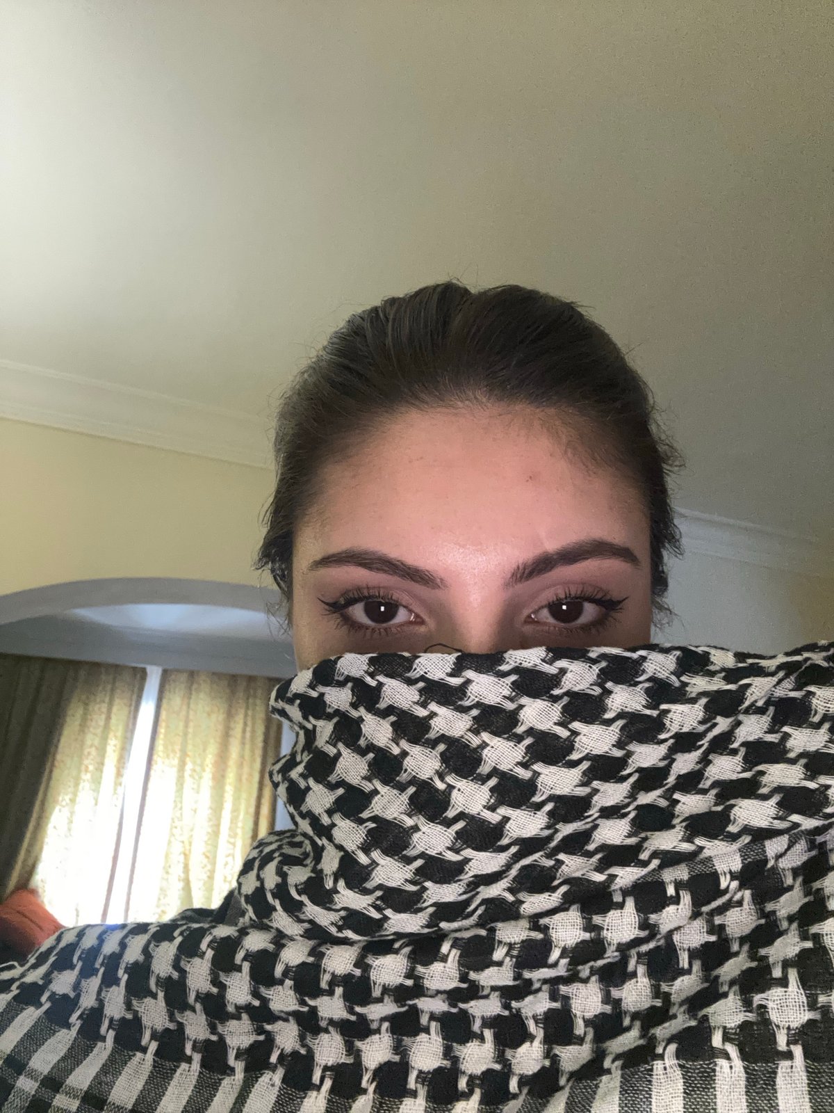 Woman photographed multiple times in urban interior setting