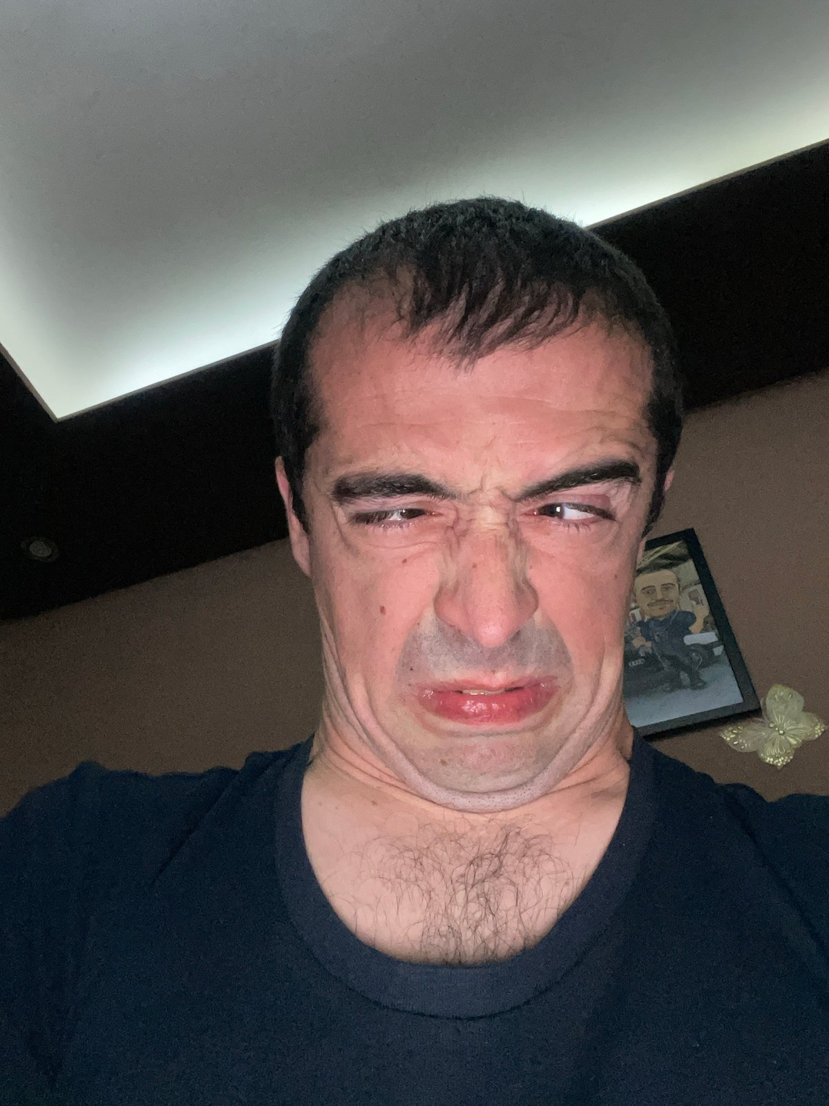 Man makes faces for camera in Sofia apartment