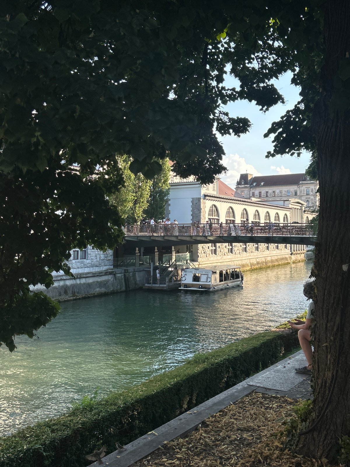 Canal boats, cobblestones, and a castle on the hill