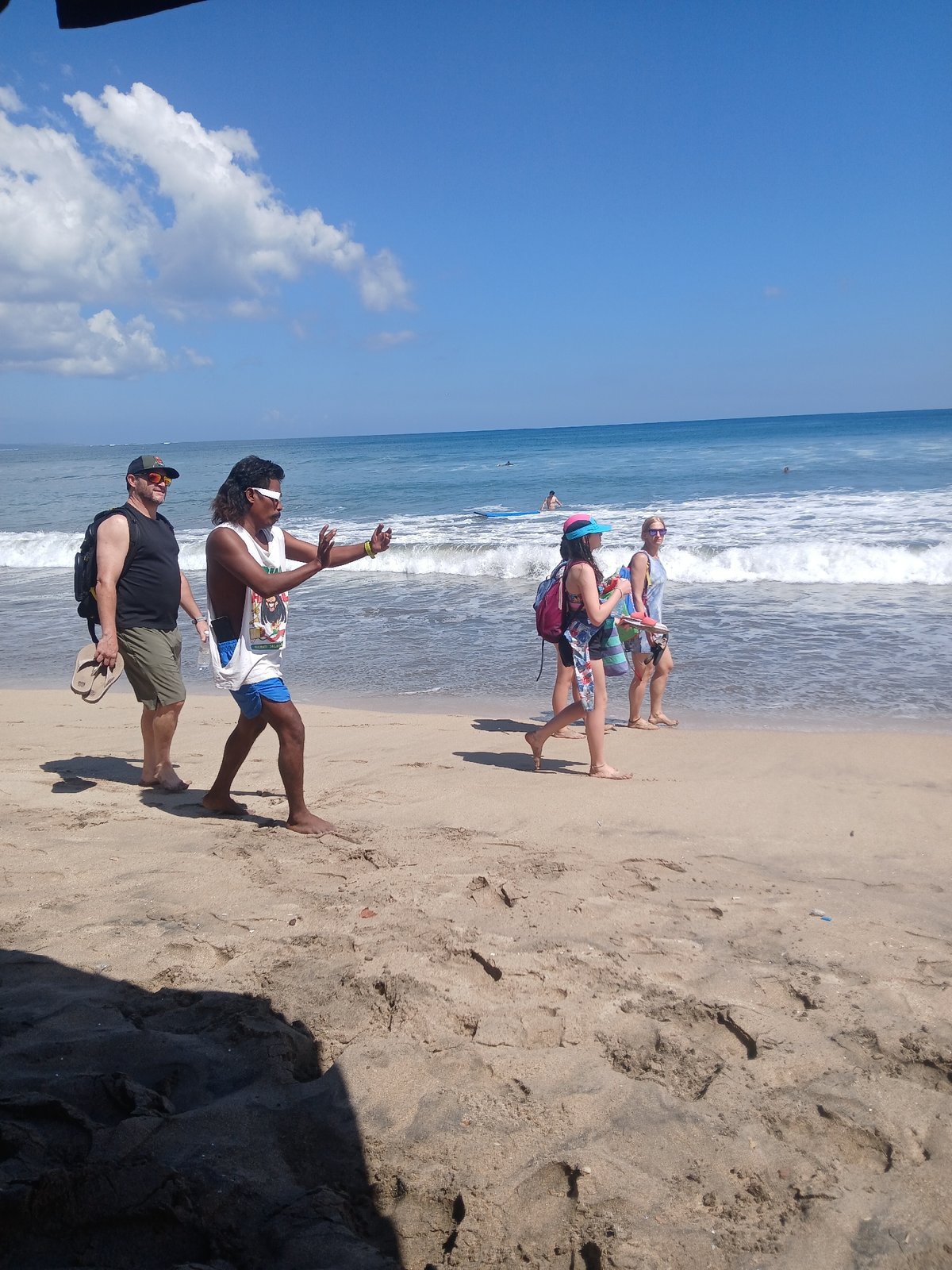 Kuta Beach in full swing on a clear Bali morning