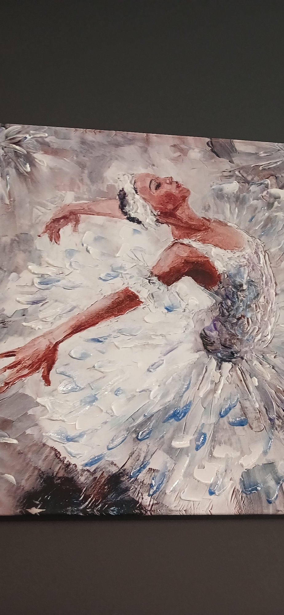 Ballerina painting in white tutu, arms extended mid-pose