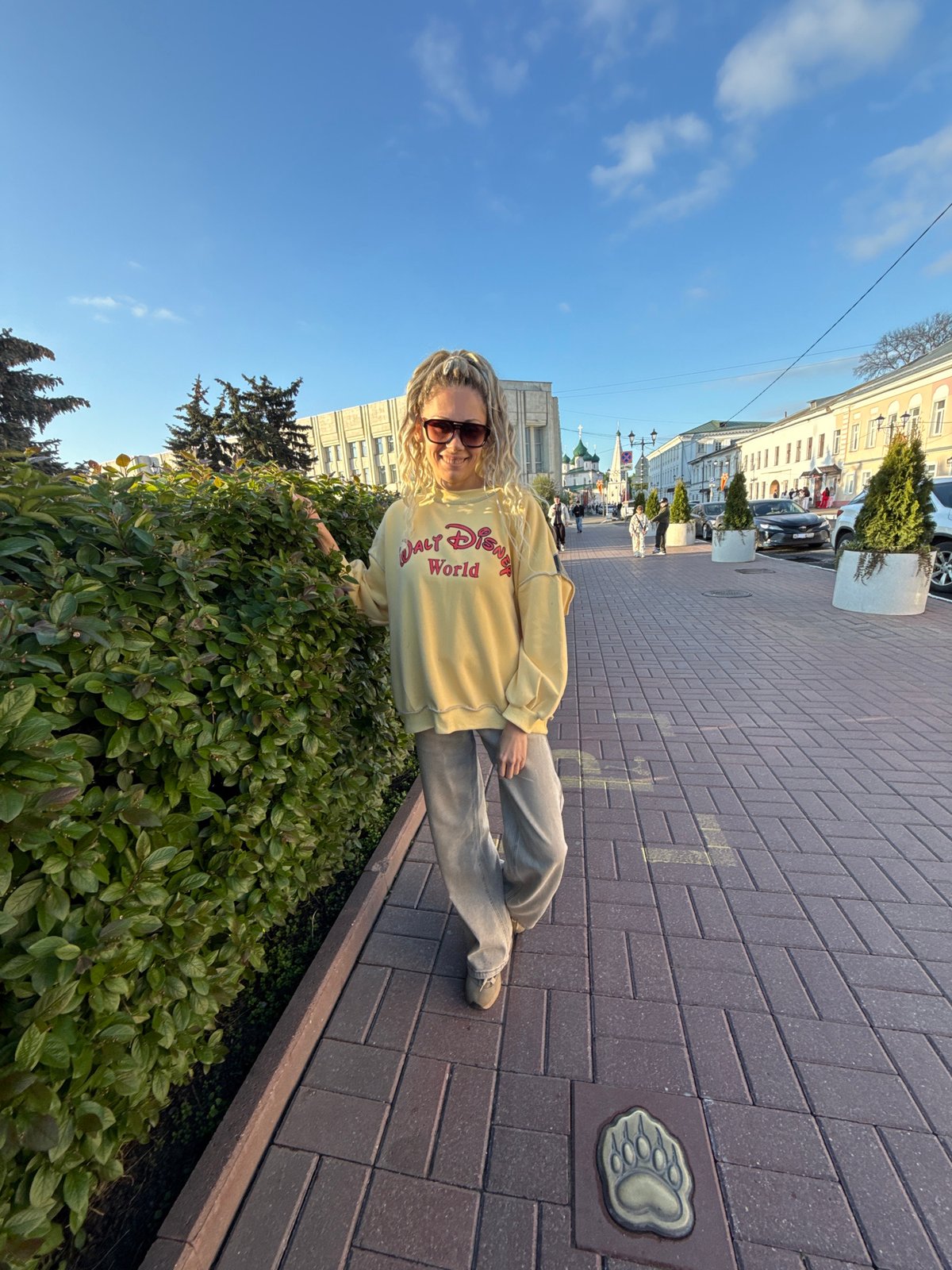 Woman in Disney sweatshirt photographed in Shebunino, Russia