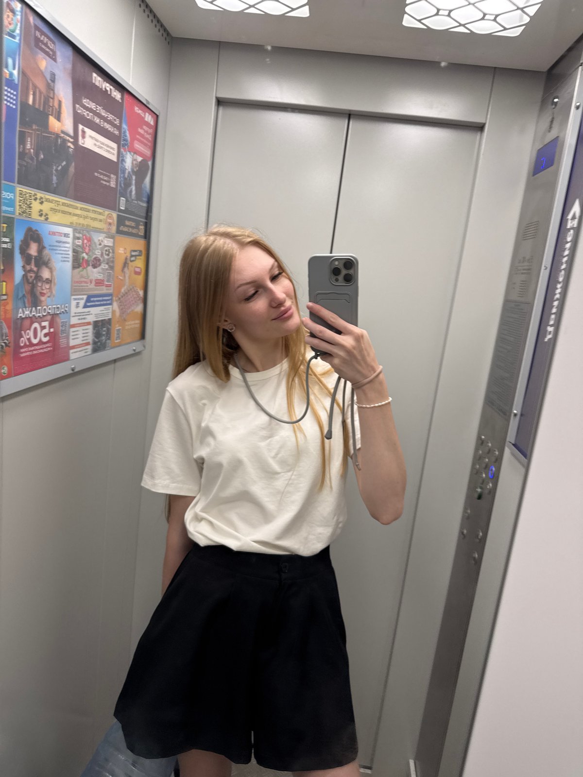 Mirror selfie in a Perm elevator, casual summer look