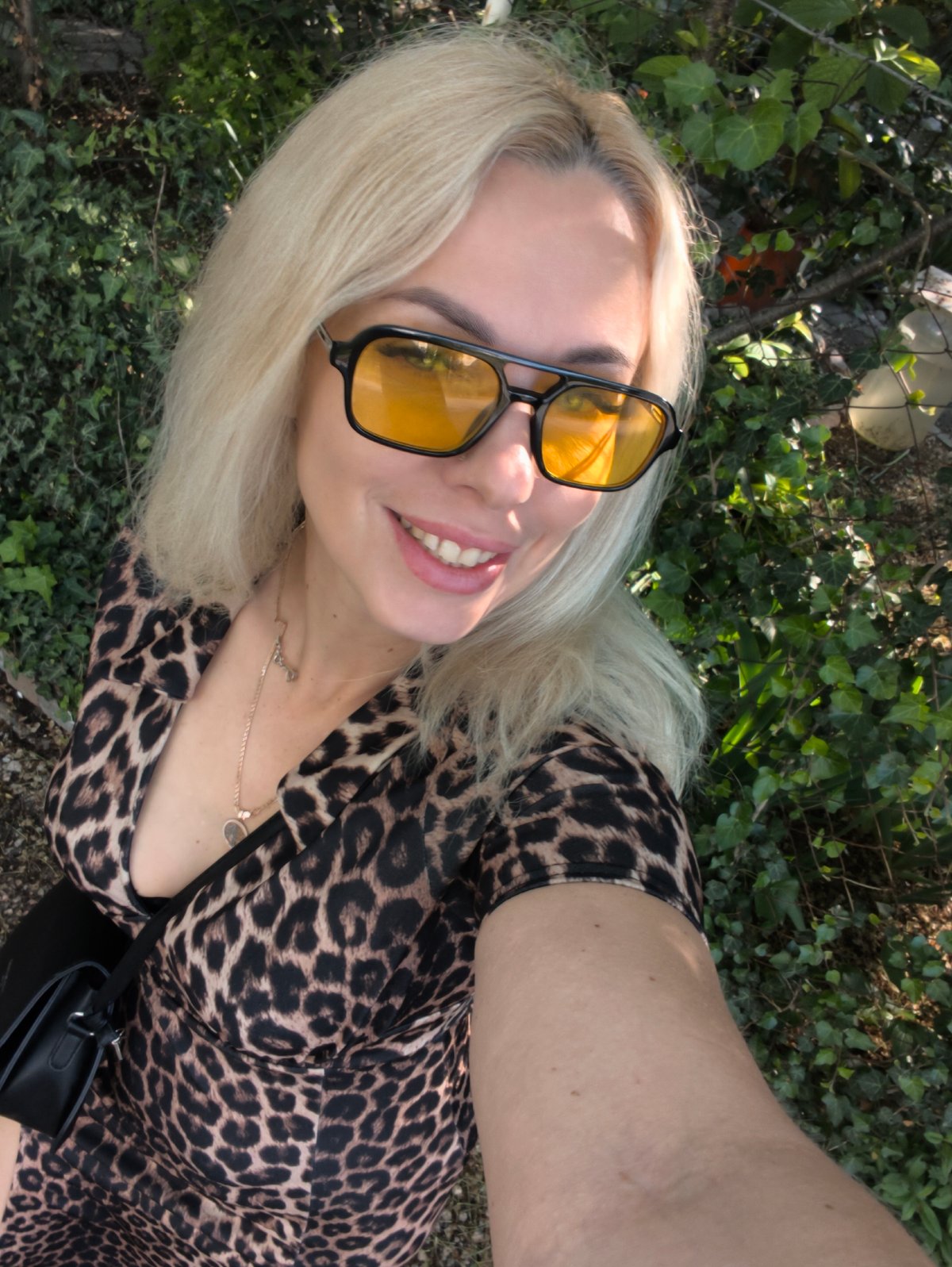 Woman takes morning selfie session in Sevastopol gardens