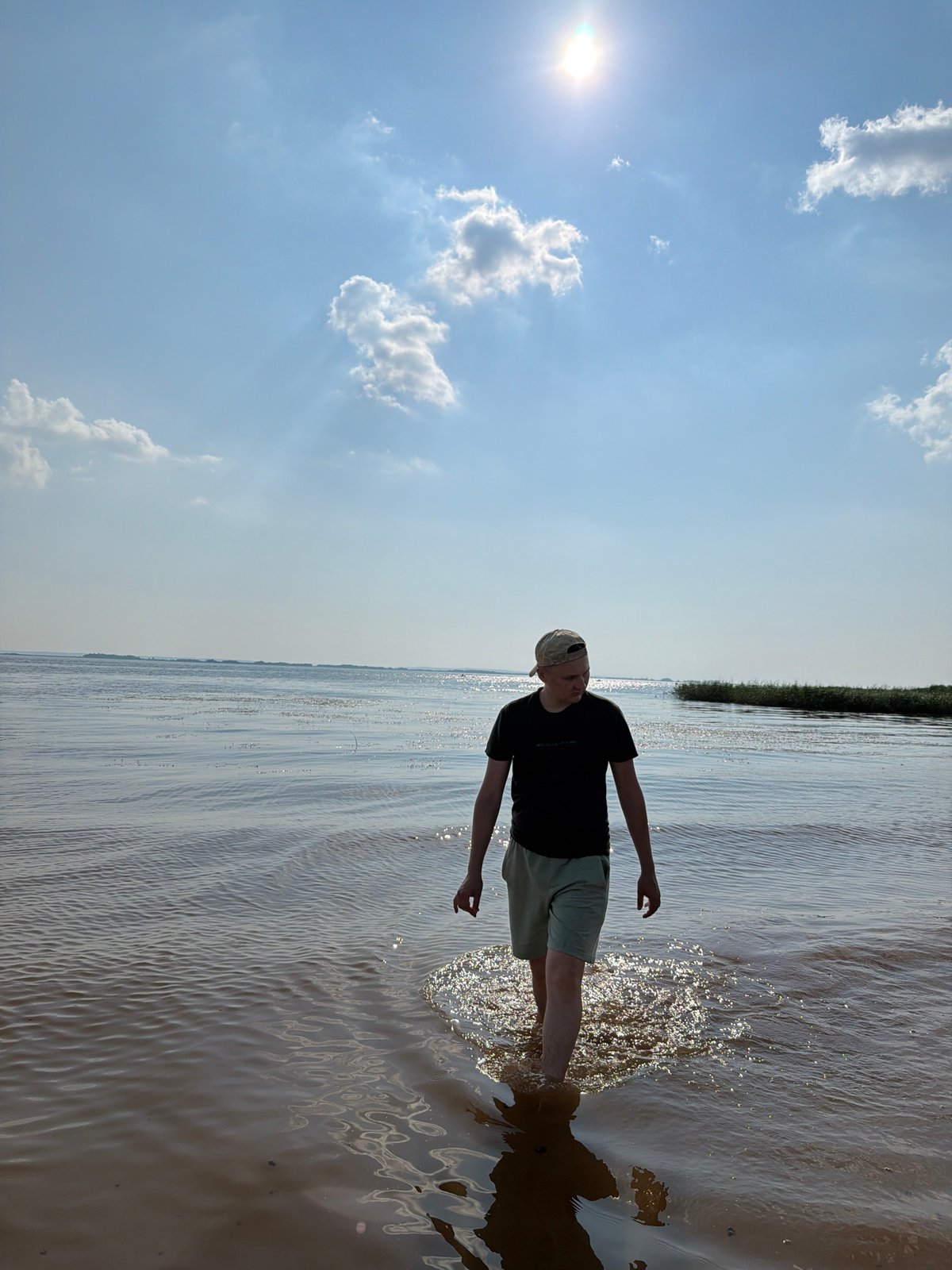 Lazy afternoon boating and wading on a Krasnyi Bor waterway.