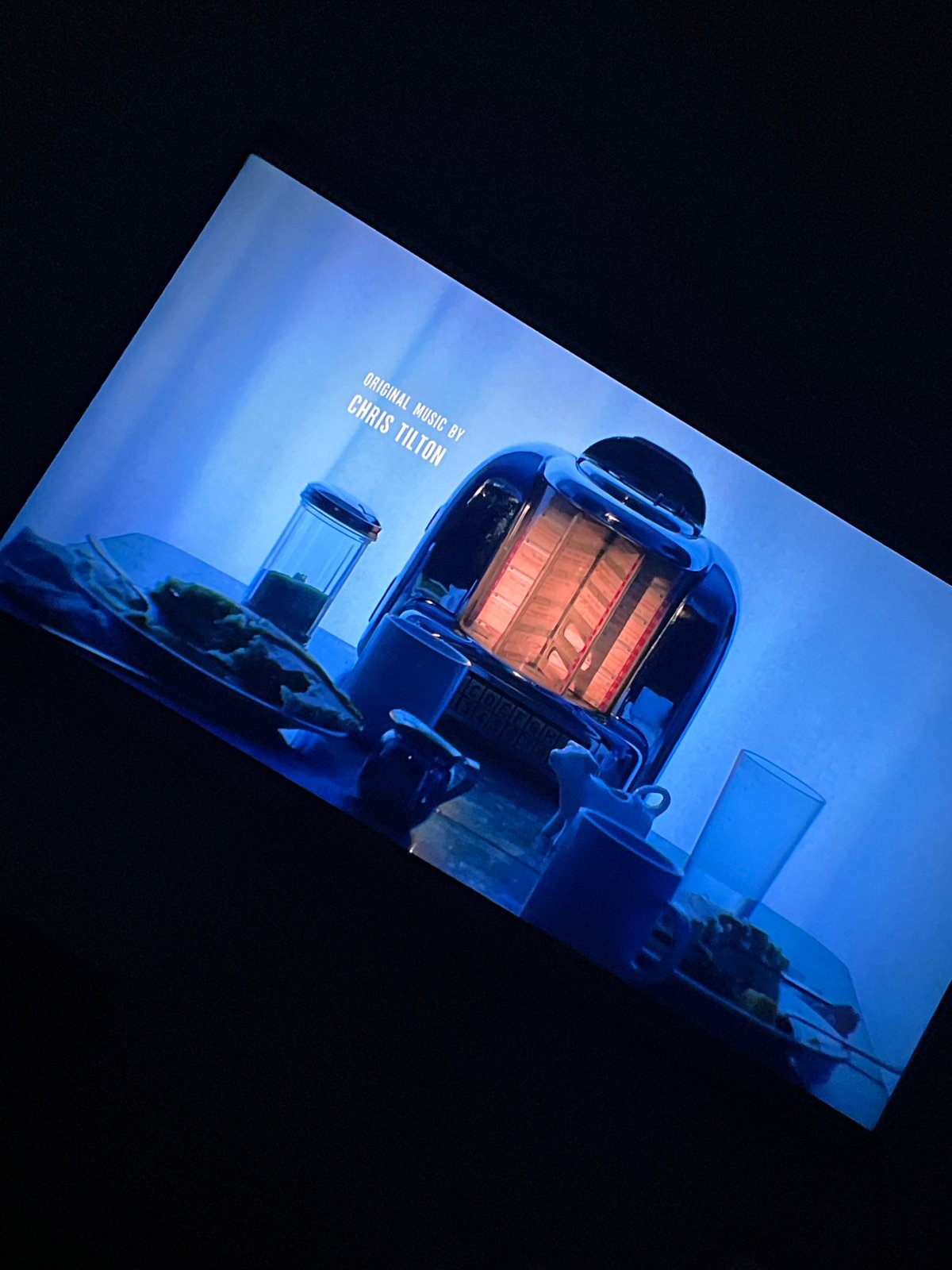 Movie end credits scene shows miniature table setting