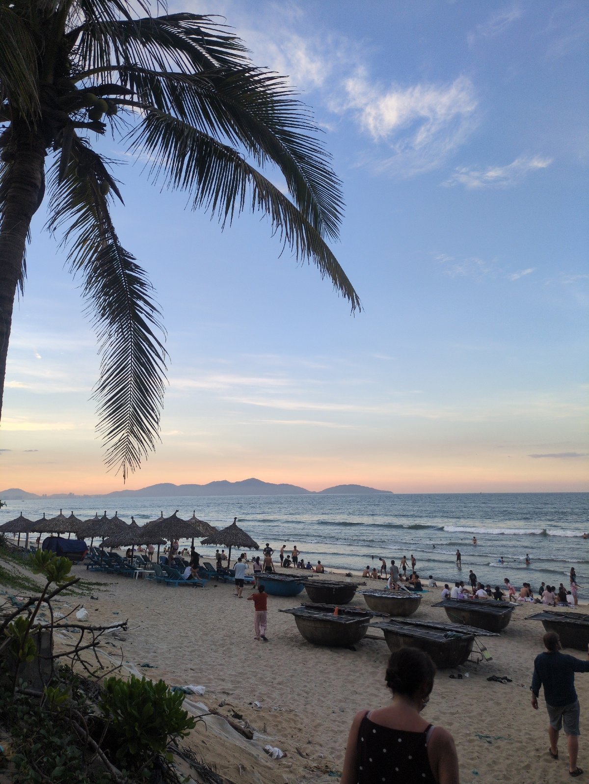An Bang Beach at golden hour, afternoon crowd to dusk
