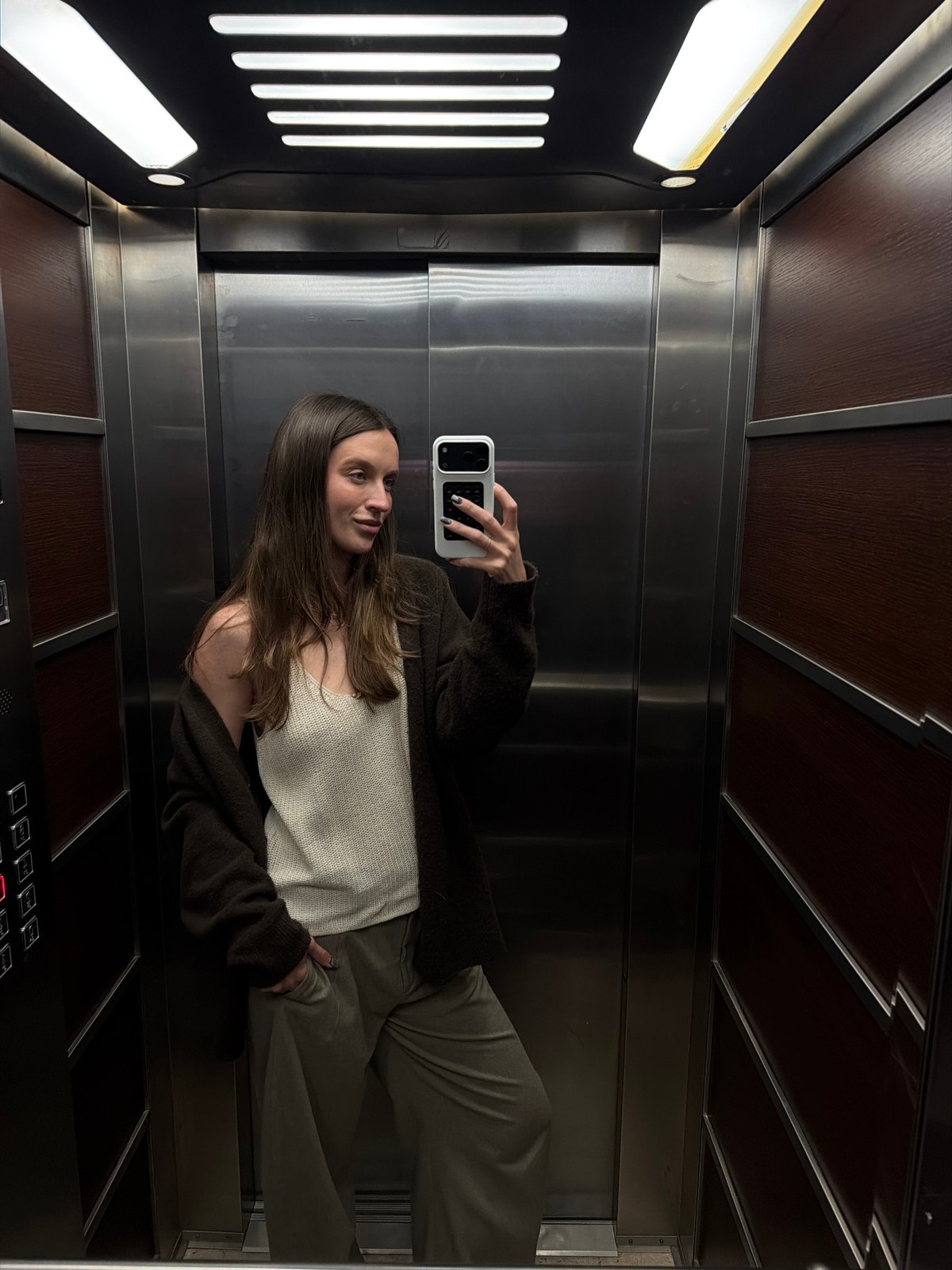 Woman Takes Selfie in Elevator in Budva, Montenegro