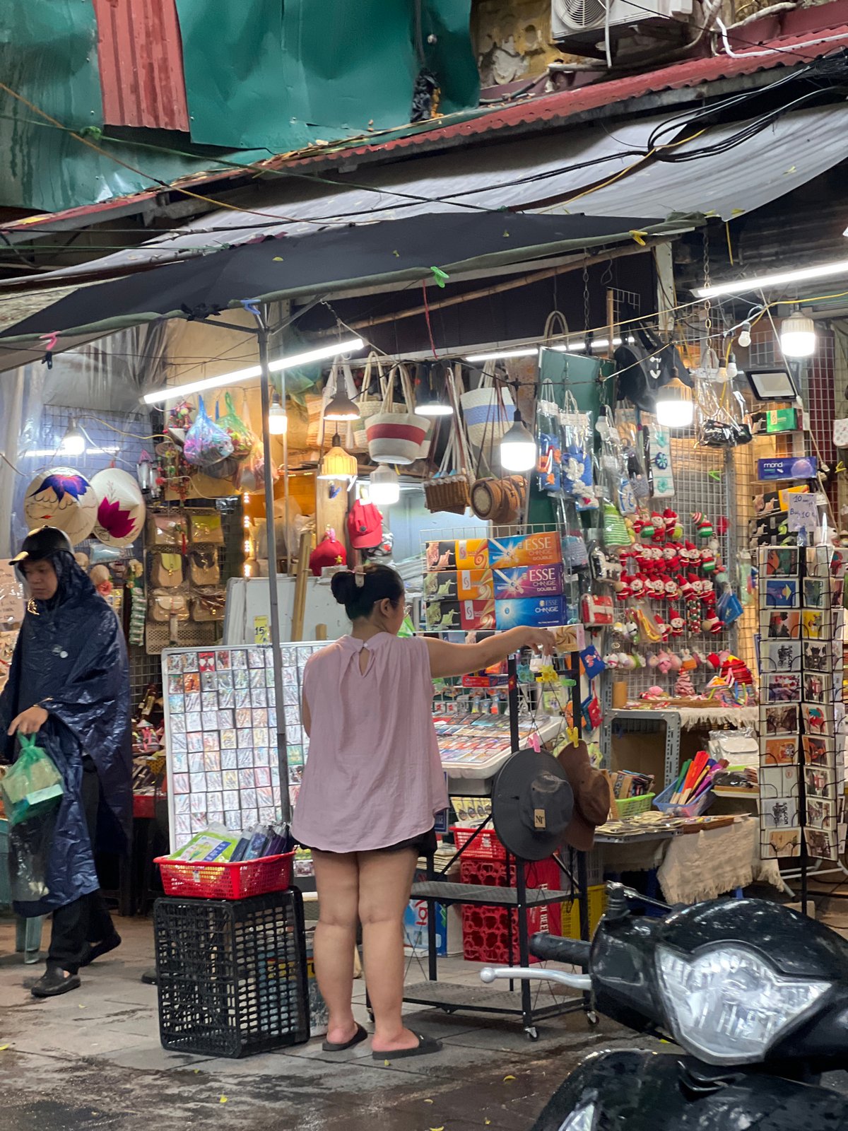 Rainy morning street life across Hanoi's Old Quarter