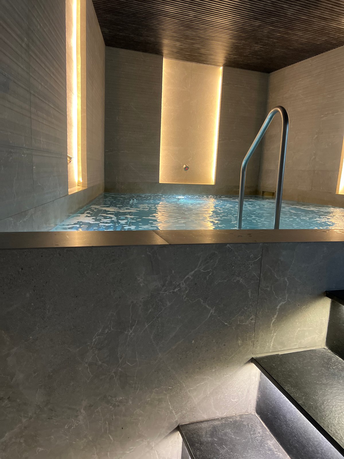 Upscale spa interior with sauna, hot tub, and fireplace in Plovdiv