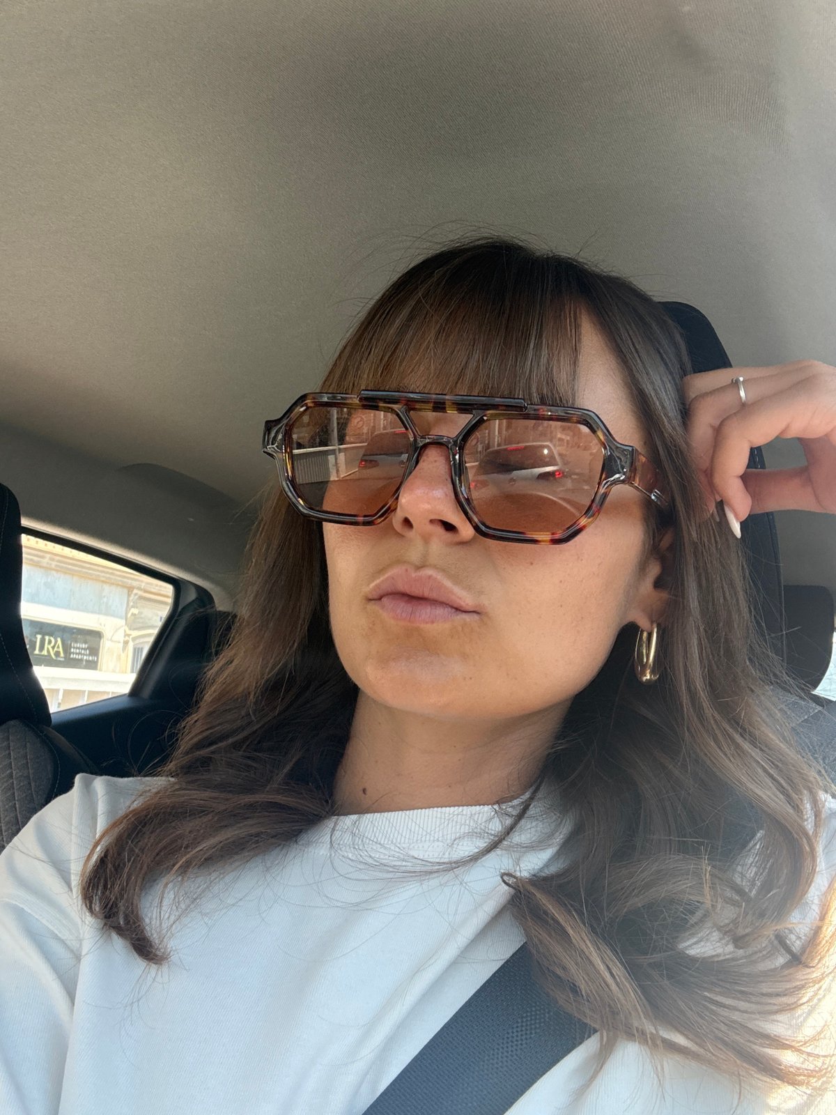 Woman photographed in stationary car in Cannes