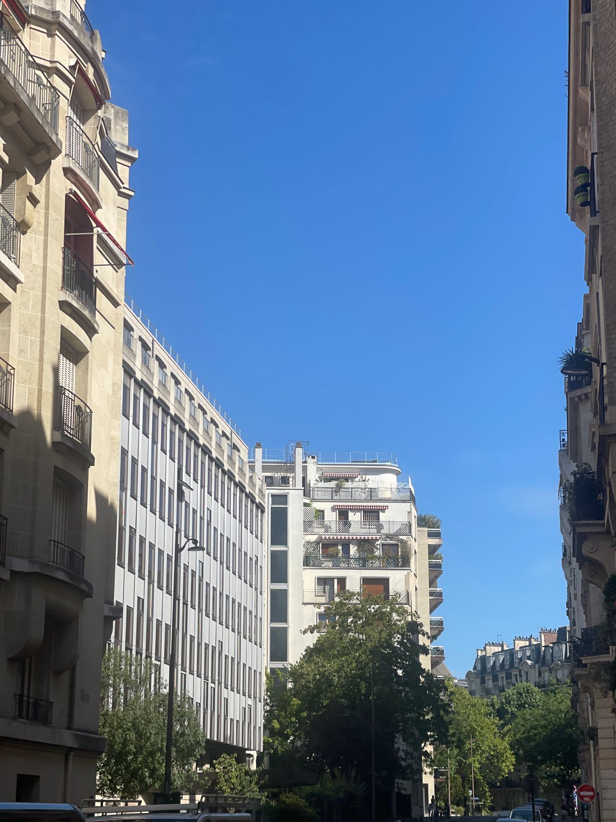 Sunny afternoon stroll through classic Paris streets in July