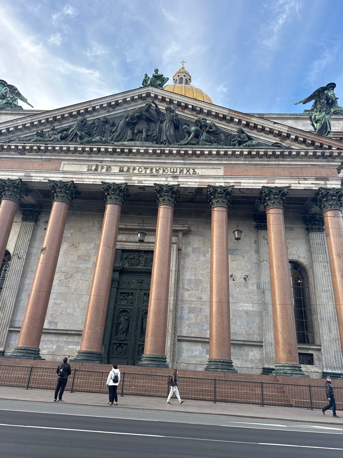 Tourist documents St. Isaac's Cathedral golden dome in Saint Petersburg