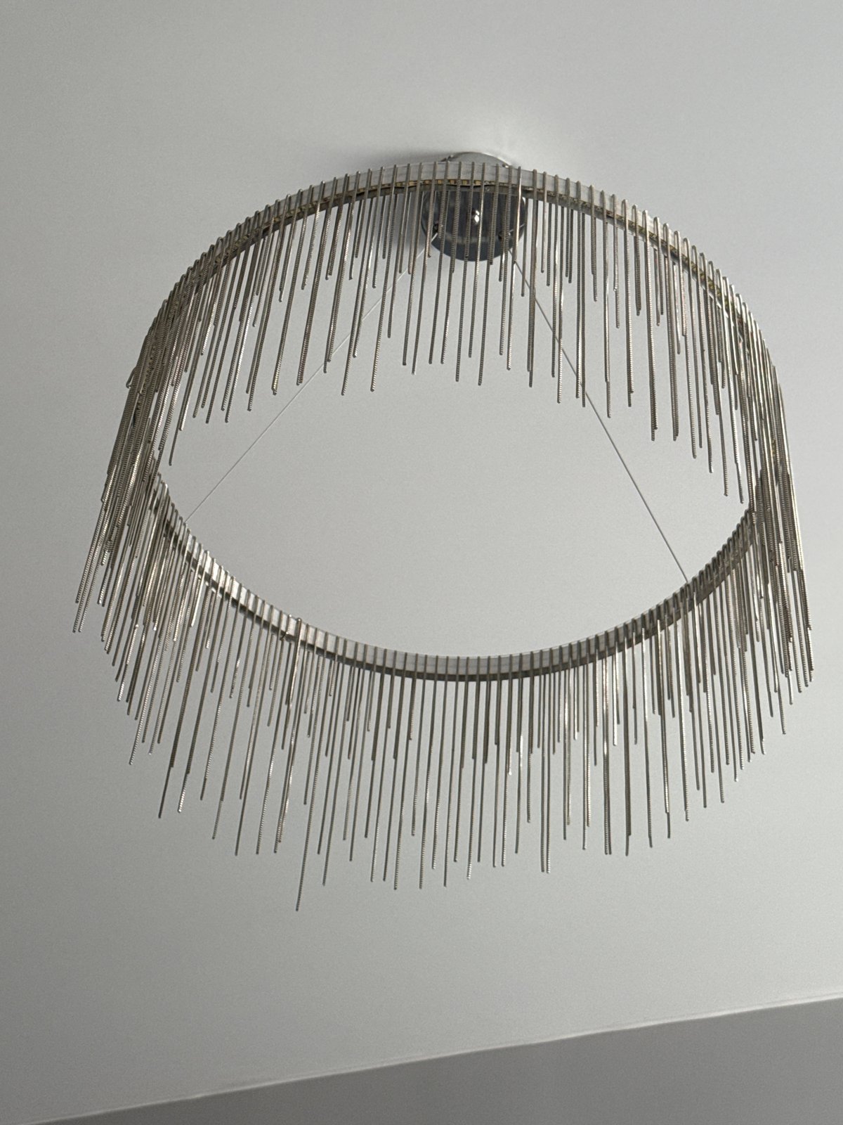 Metal ring sculpture documented on wall in Krasnoyarsk