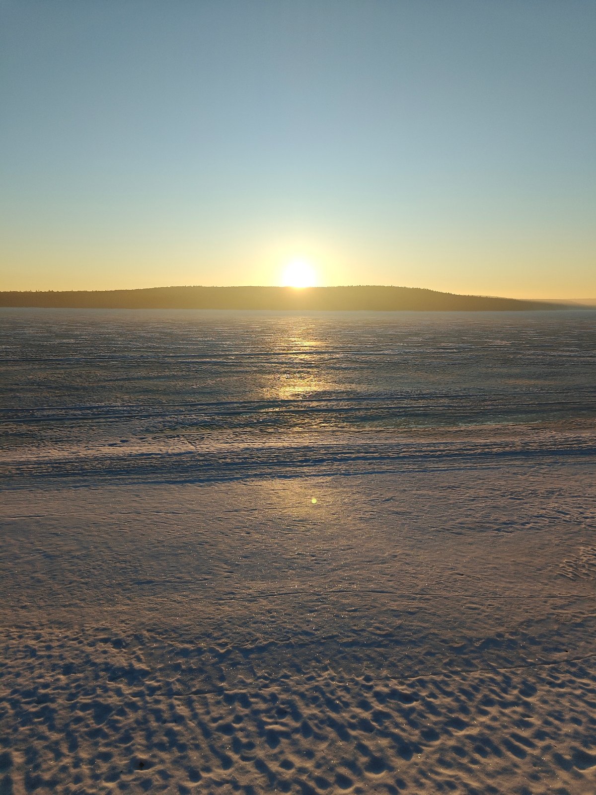 Early morning winter walk documented along Kama River in Chaikovsky