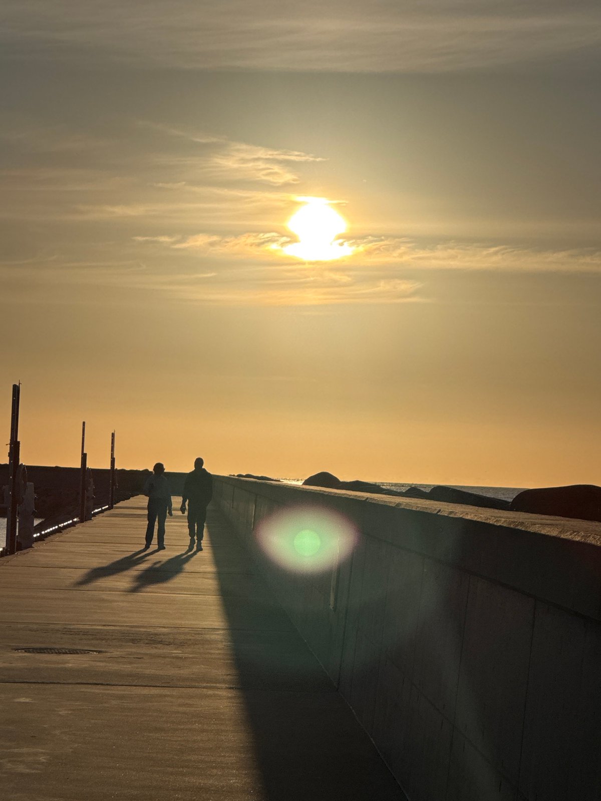 Evening maritime life unfolds along Tallinn's sunset waterfront