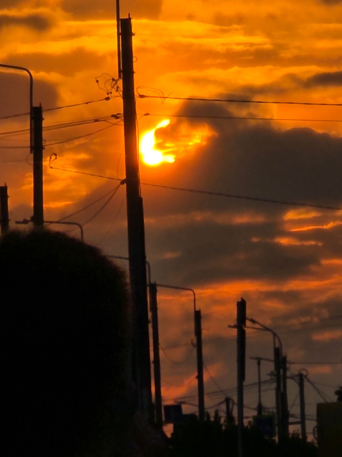 Sunset over Chaikovsky's rail yard and city streets