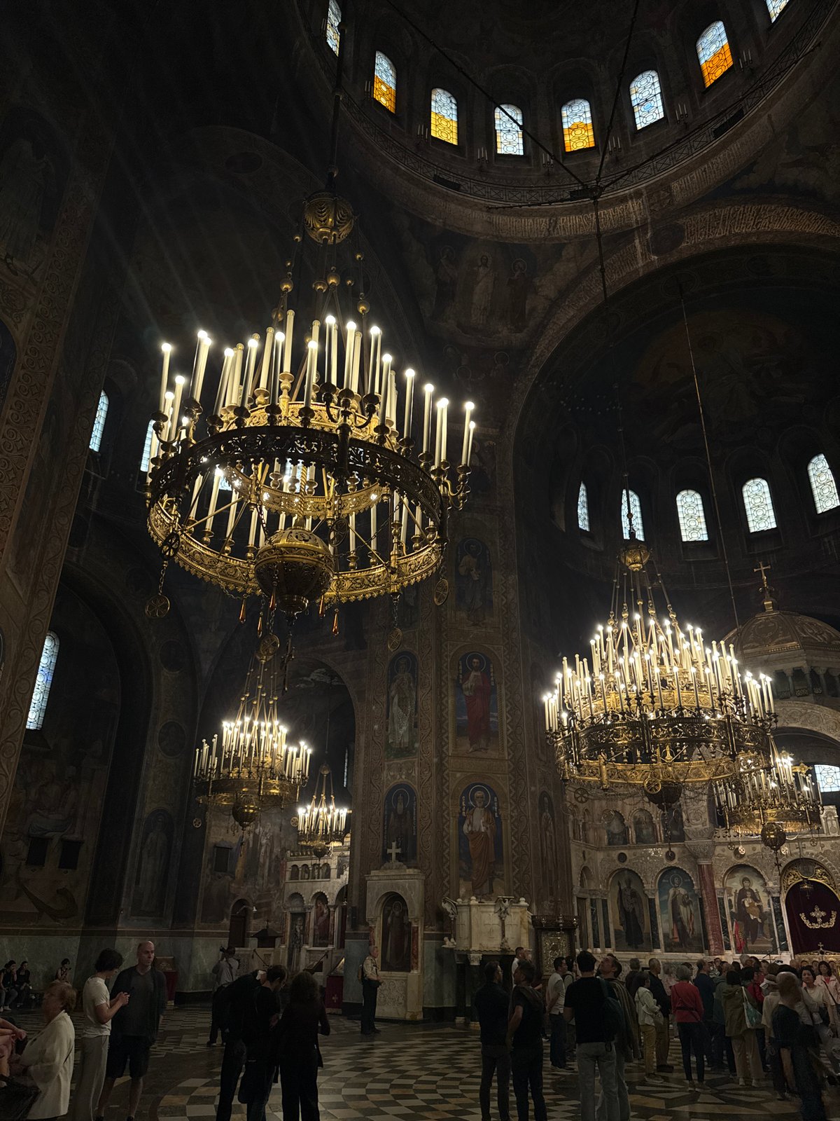 Formal ceremony with luxury cars at ornate church