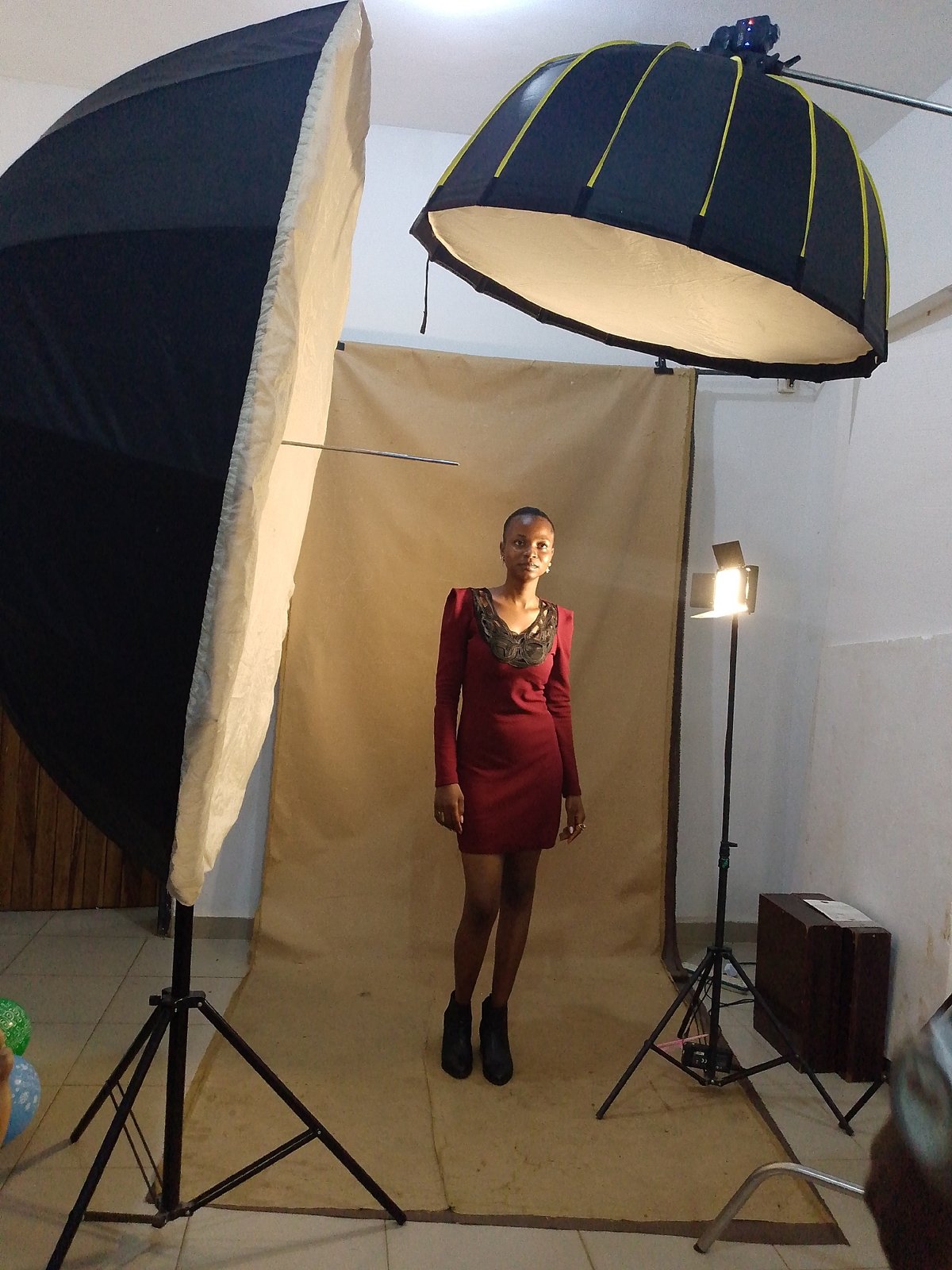 Photography session with model in red dress documented