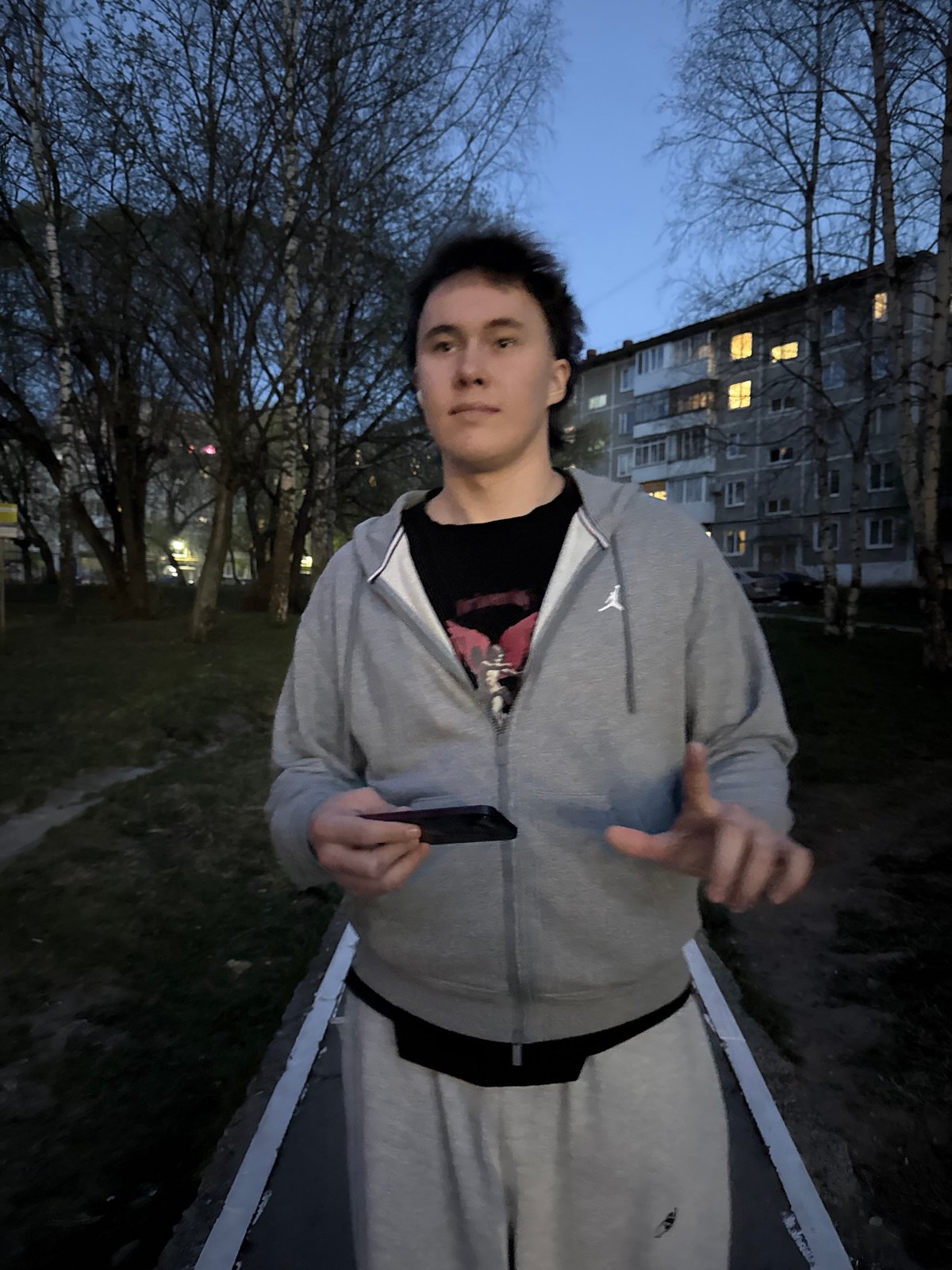 Young man spotted with phone outside building in Perm