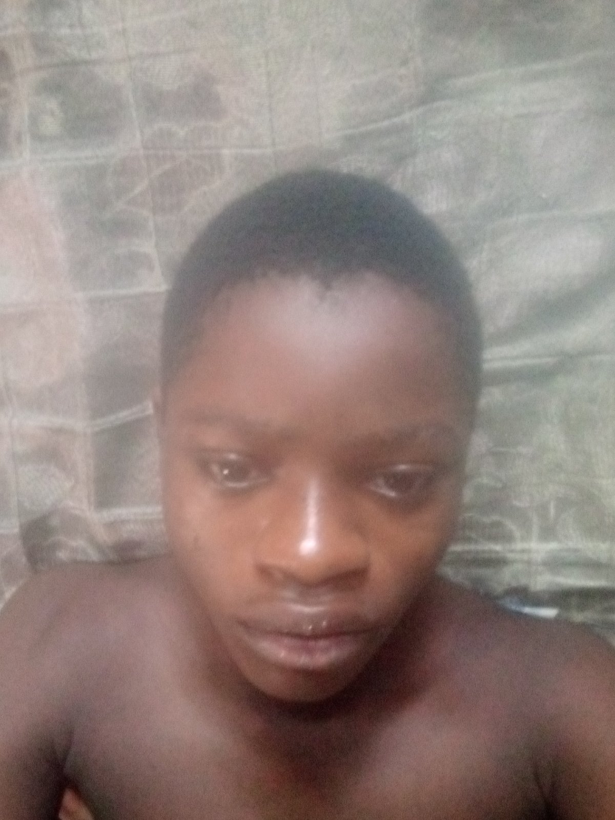 Person photographed resting in Shangisha, Nigeria