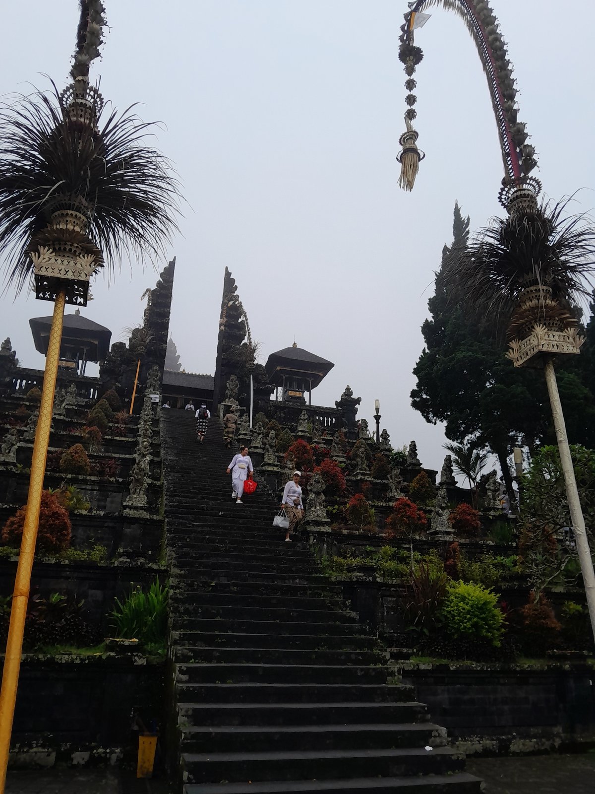 Foggy morning at Balinese temples in Rendang draws visitors