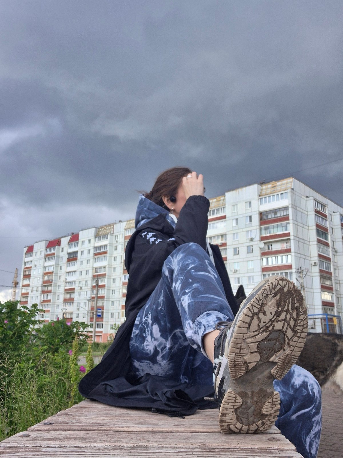 Ordinary afternoon moments captured under dramatic skies in Chaikovsky