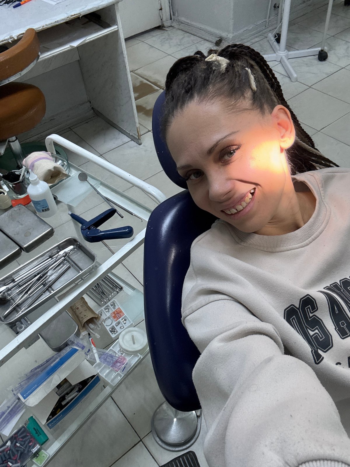 Woman receives dental treatment in Rusanovo clinic