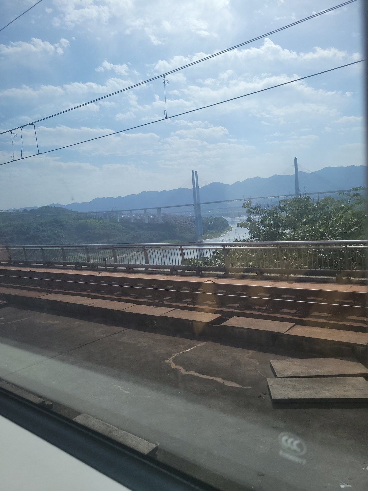 Train passenger captures bridge landscape views in Liangjiang, China
