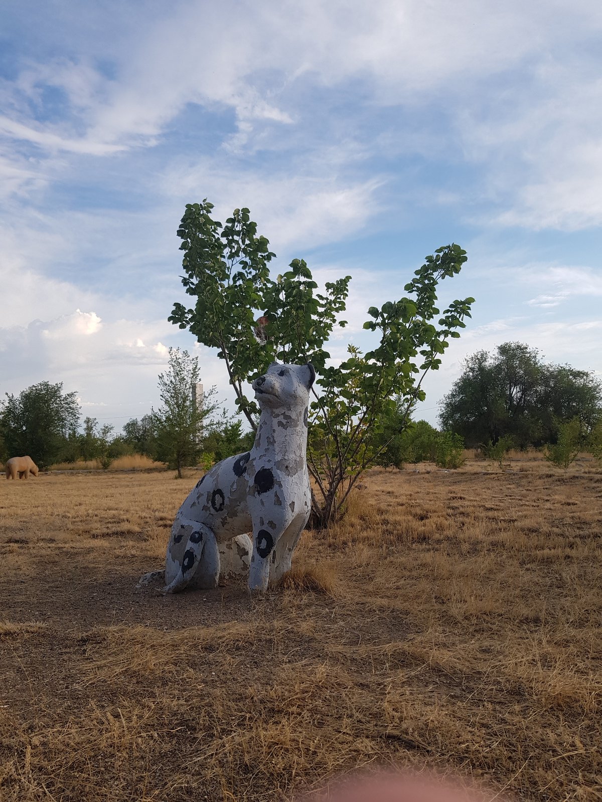 Weathered sculptures and landmarks dot a quiet Kurchatov park