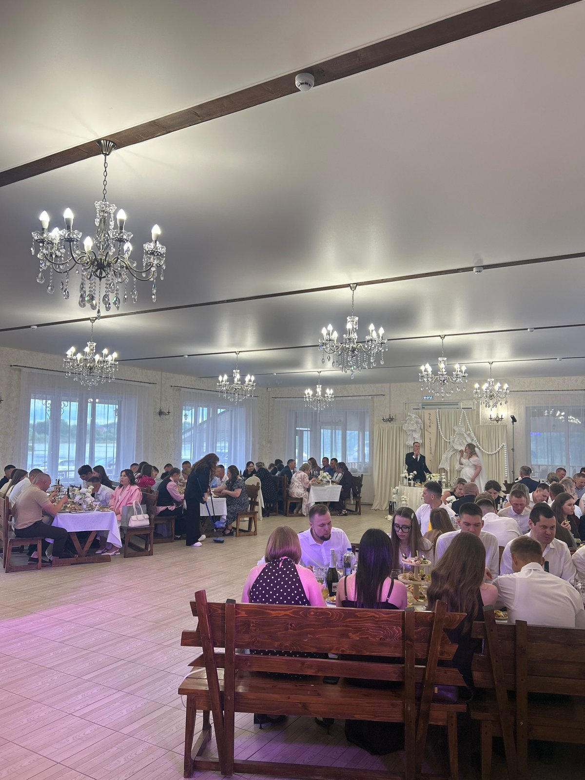 Wedding reception celebrated in Sharkan, Russia with indoor-outdoor festivities