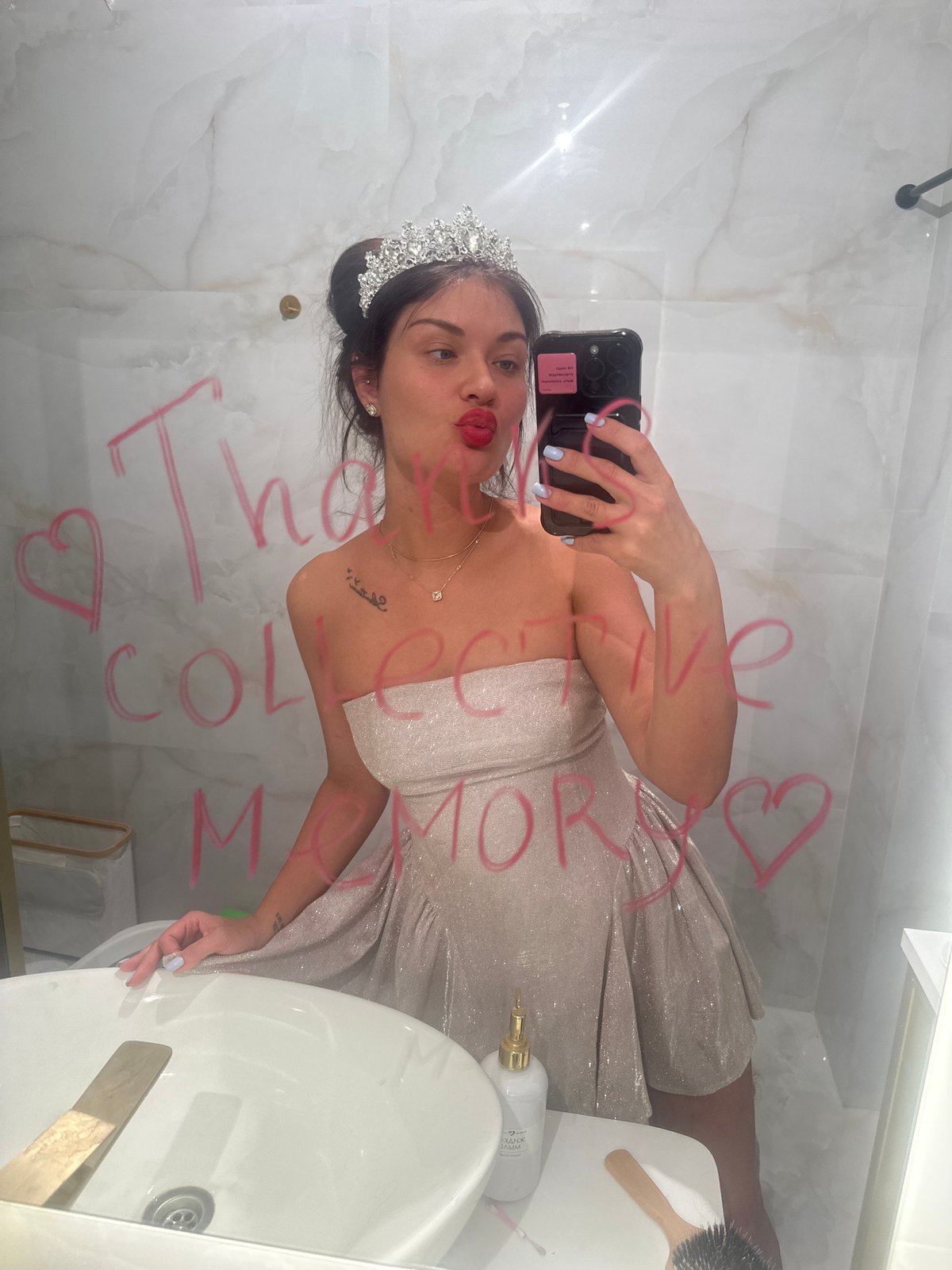 Woman takes mirror selfie in Moscow bathroom