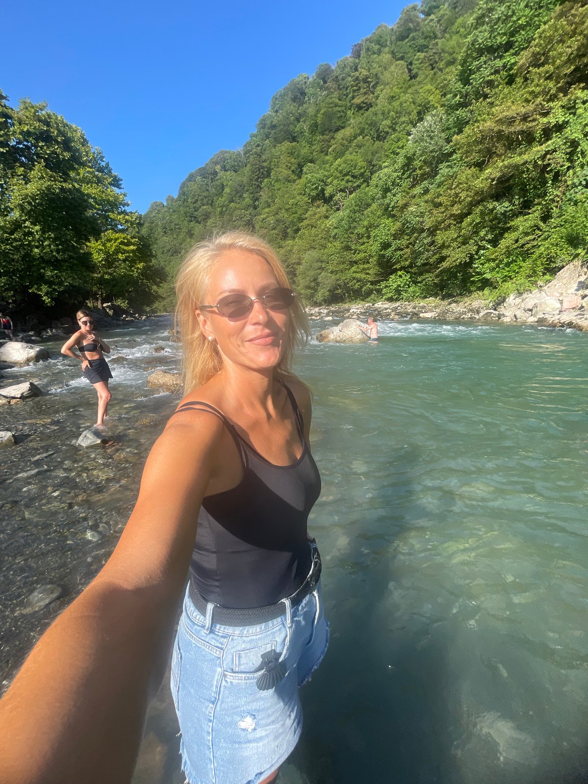 Lazy summer afternoon at a turquoise river in Sochi