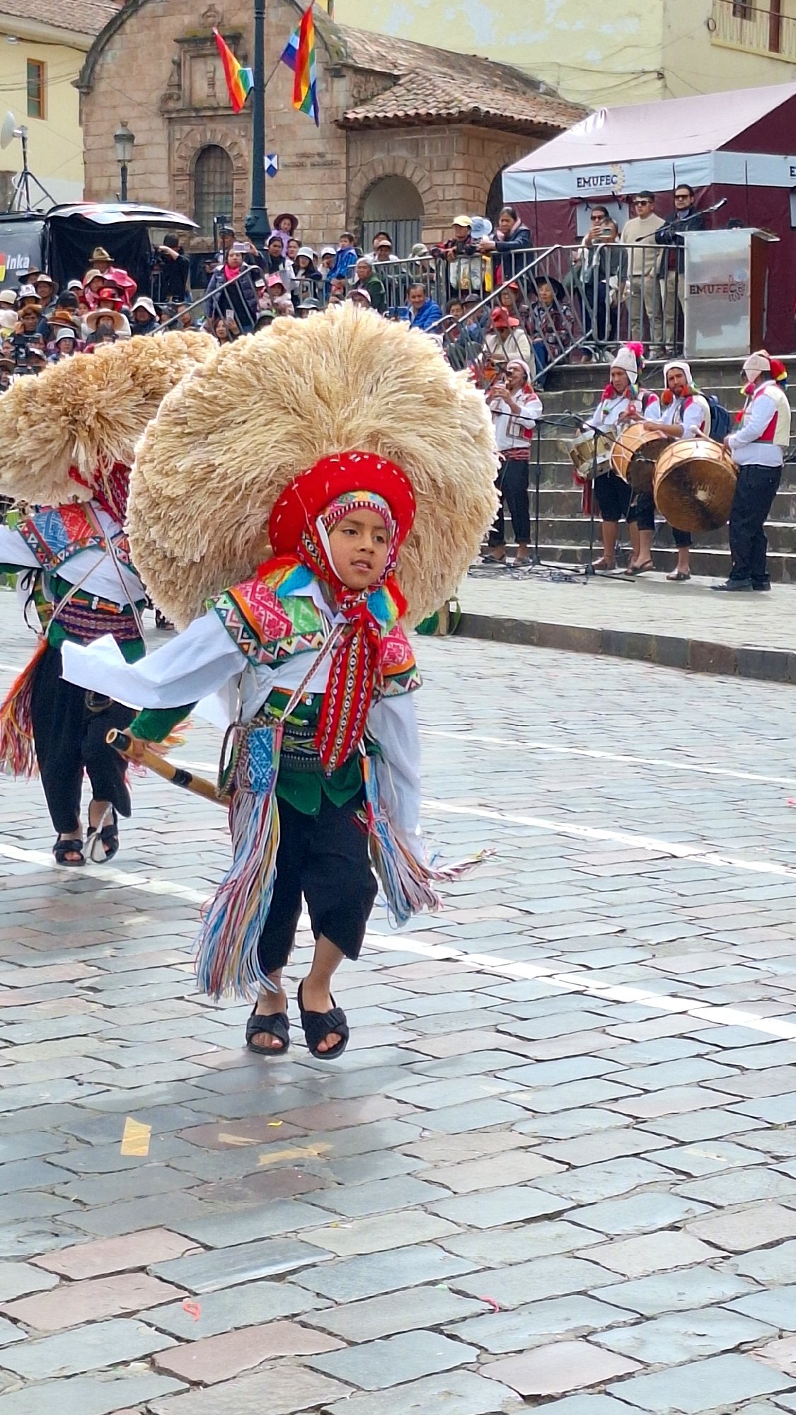 Children parade in traditional dress during Cuzco cultural festival