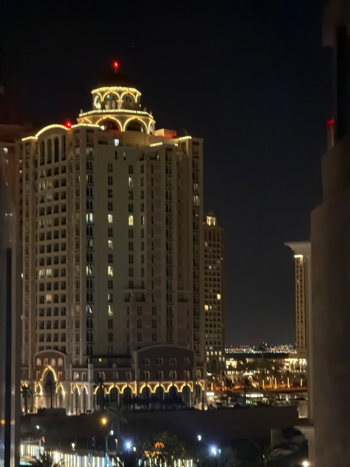 Nighttime views documented across Qatar's Pearl development over evening hours