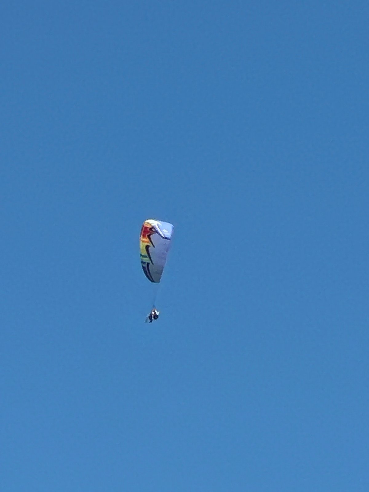 Paragliders and parasails fill the skies above Boreti's Adriatic beach