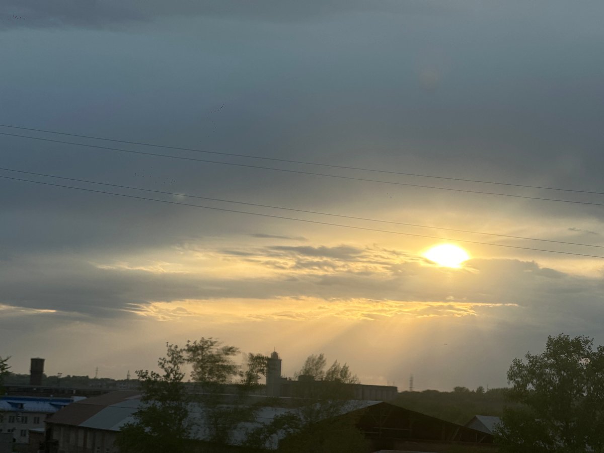 Sunset observed over Biysk, Russia with birds in flight