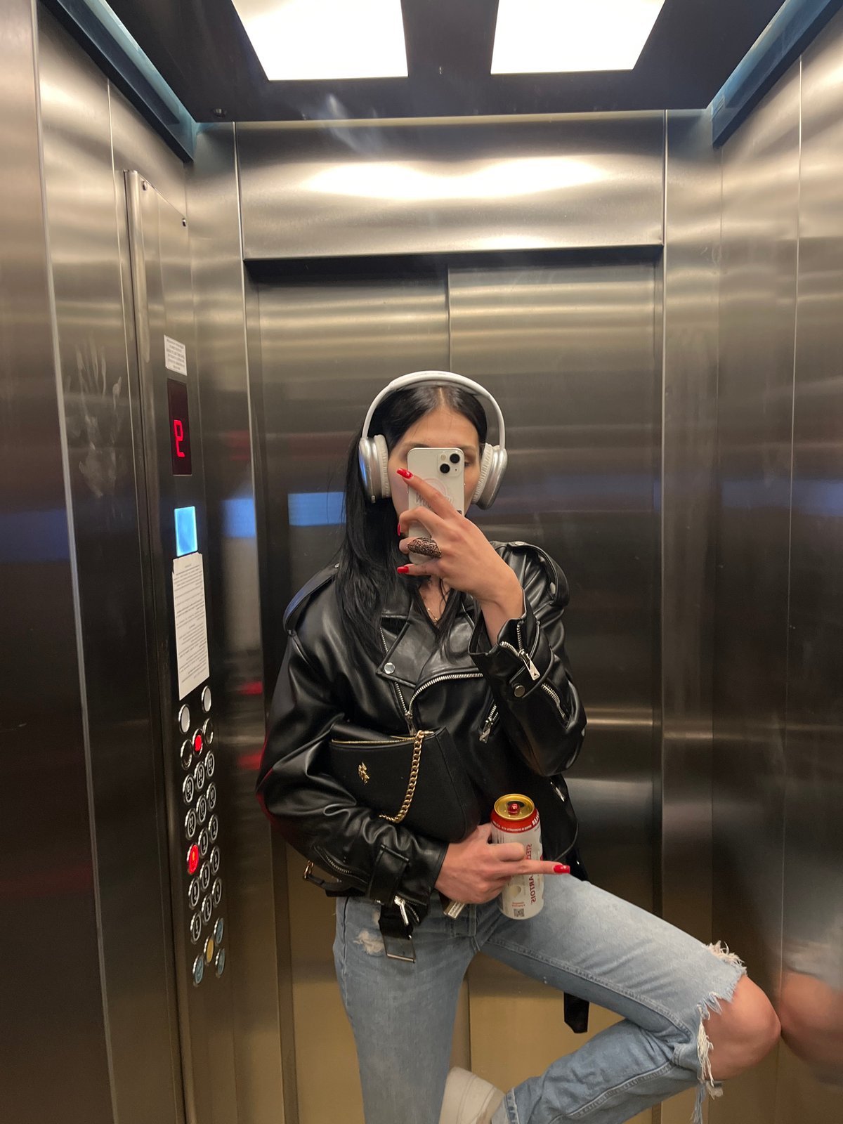 Elevator selfie and a metallic dragonfly sculpture, same night